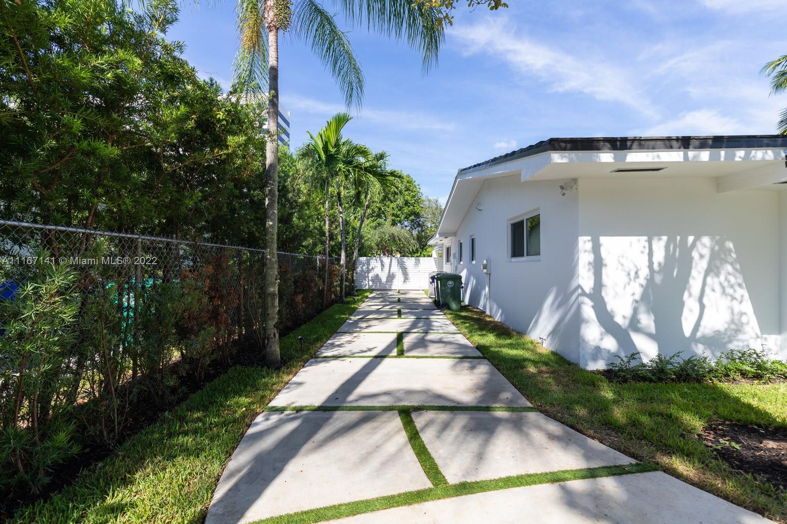 4730 Bay Point Road Miami, FL 33137 - Photo 2 of 25 a view of a backyard with plants