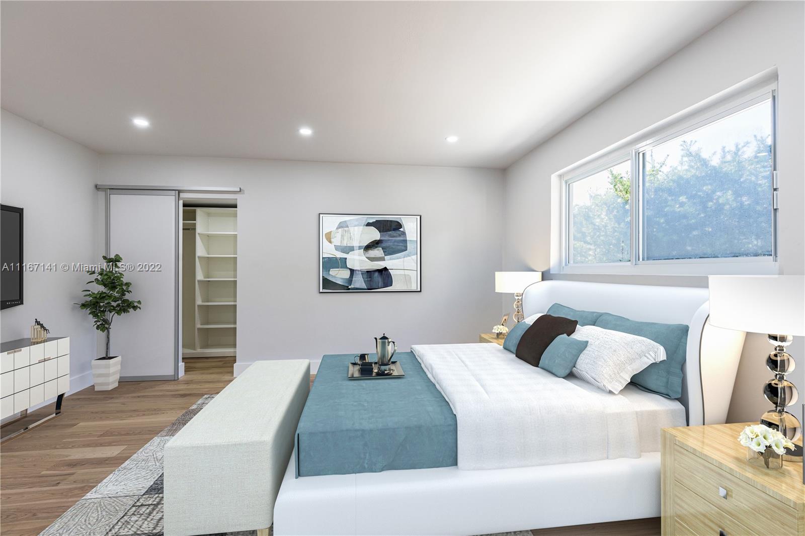 4730 Bay Point Road Miami, FL 33137 - Photo 21 of 25 a bedroom with a large bed and a window