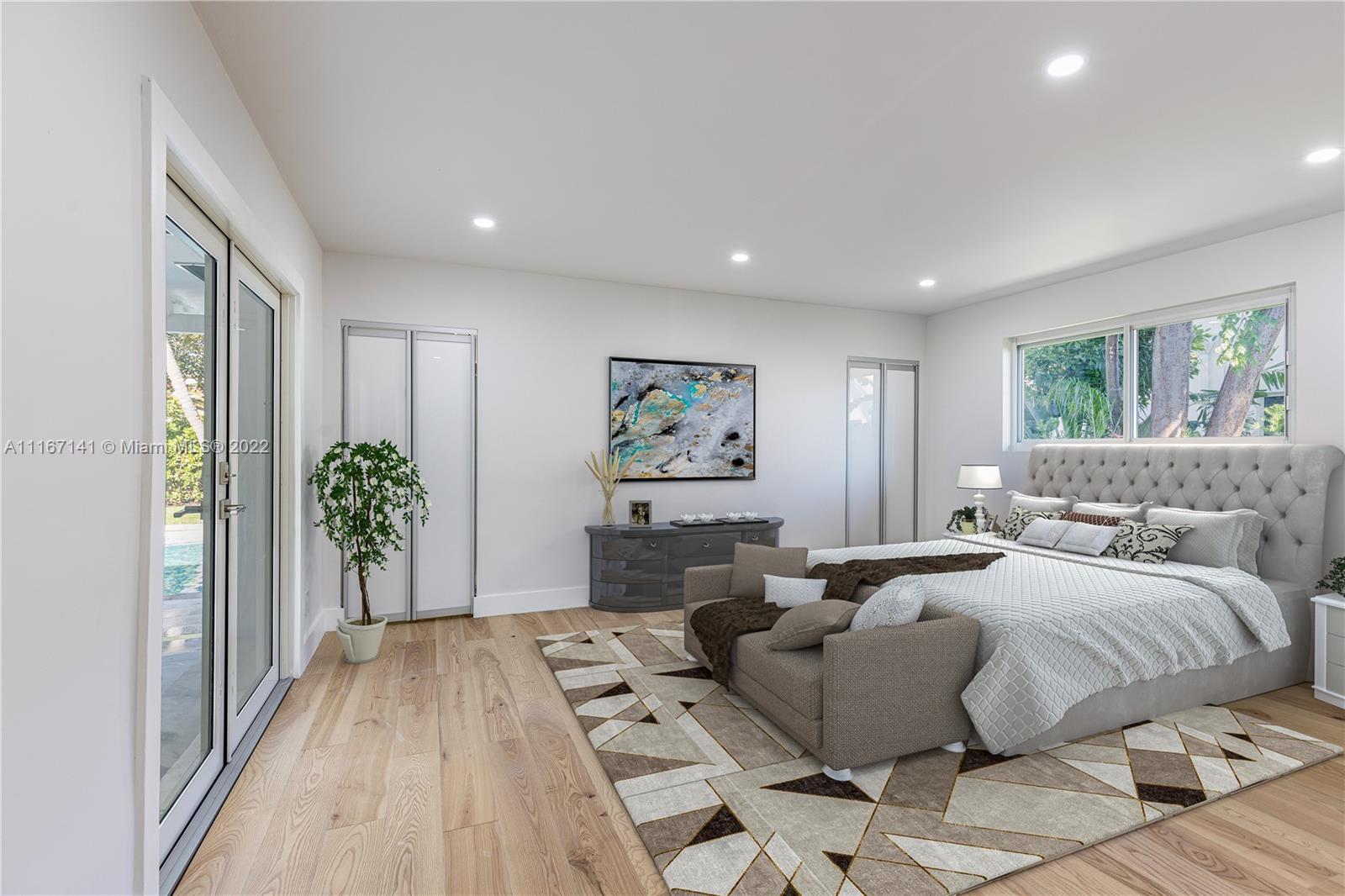 4730 Bay Point Road Miami, FL 33137 - Photo 22 of 25 a bedroom with furniture and a large window