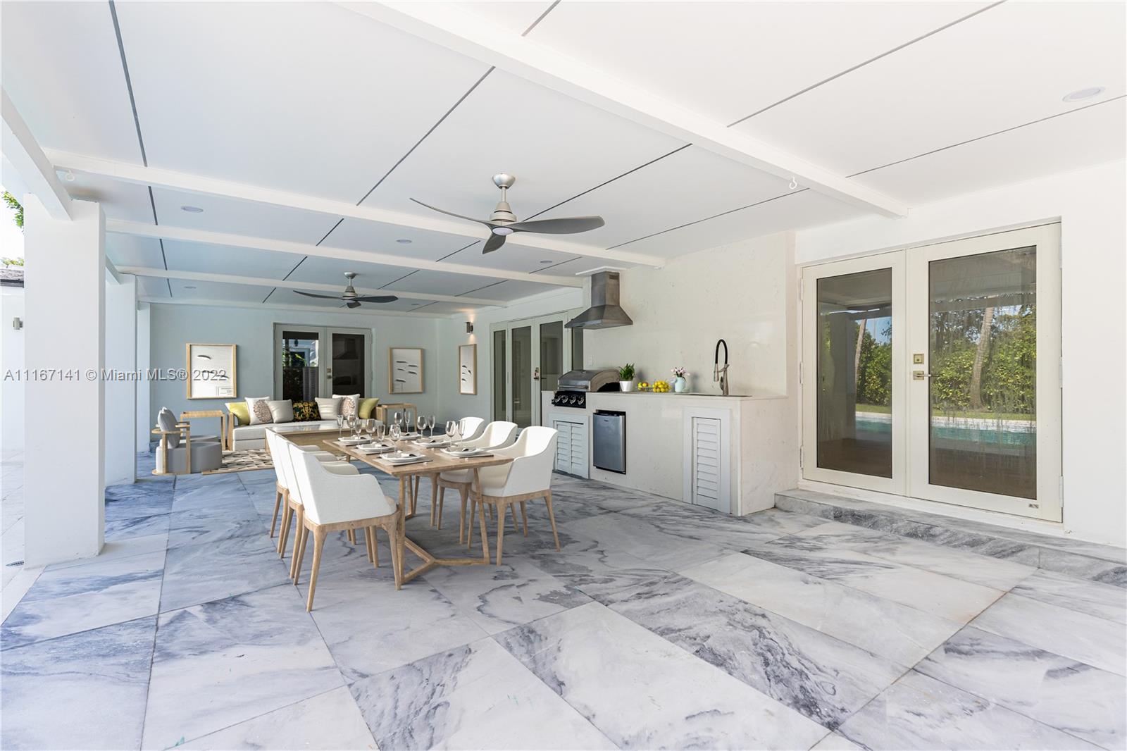 4730 Bay Point Road Miami, FL 33137 - Photo 5 of 25 a view of a dining room with furniture