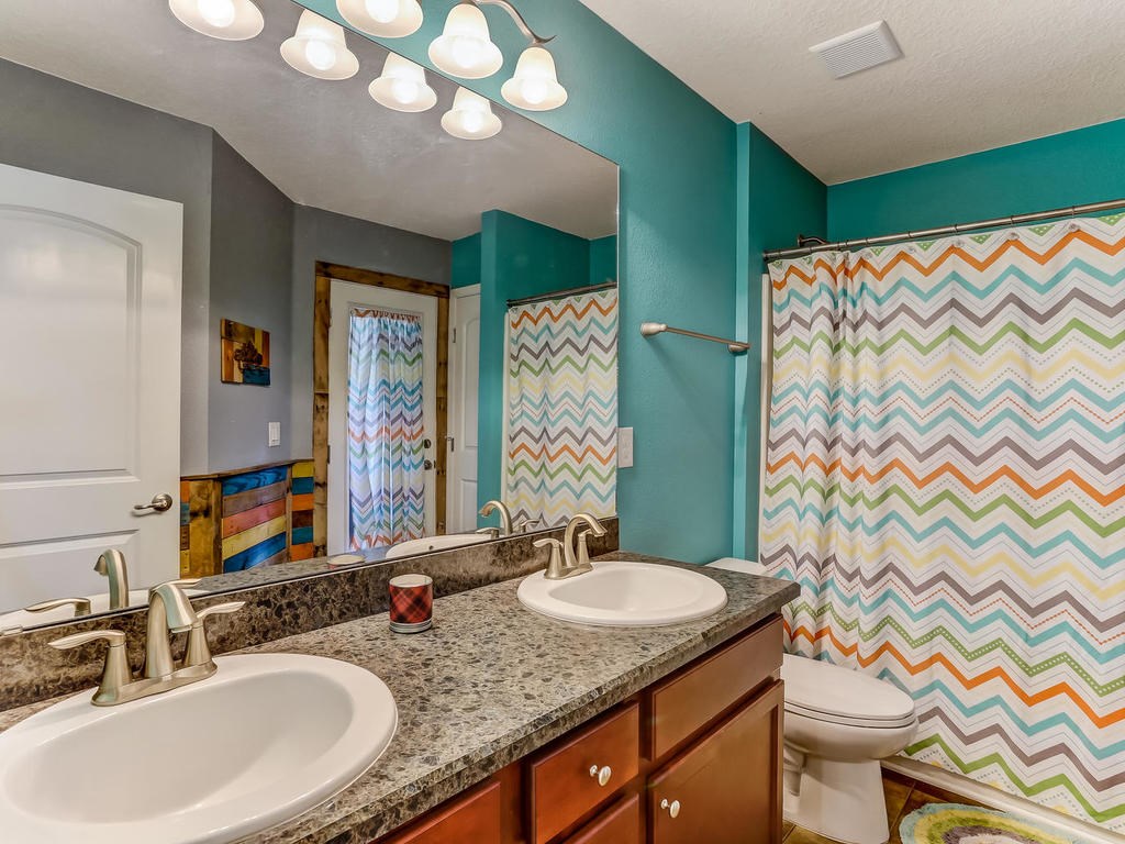 88358 Maybourne Road Yulee, FL 32097 - Photo 18 of 27 a bathroom with a granite countertop sink and a mirror