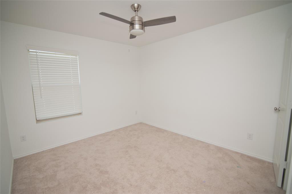 3701 Harper Street Little Elm, TX 75068 - Photo 15 of 26 an empty room with a fan & a window