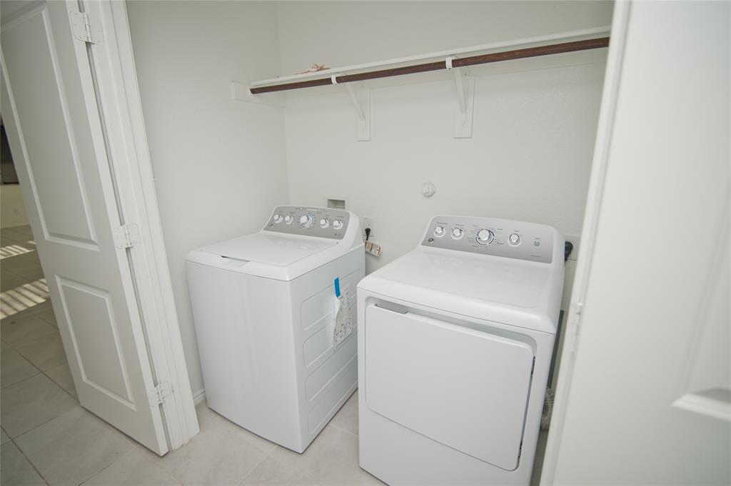 3701 Harper Street Little Elm, TX 75068 - Photo 20 of 26 a utility room with dryer and washer