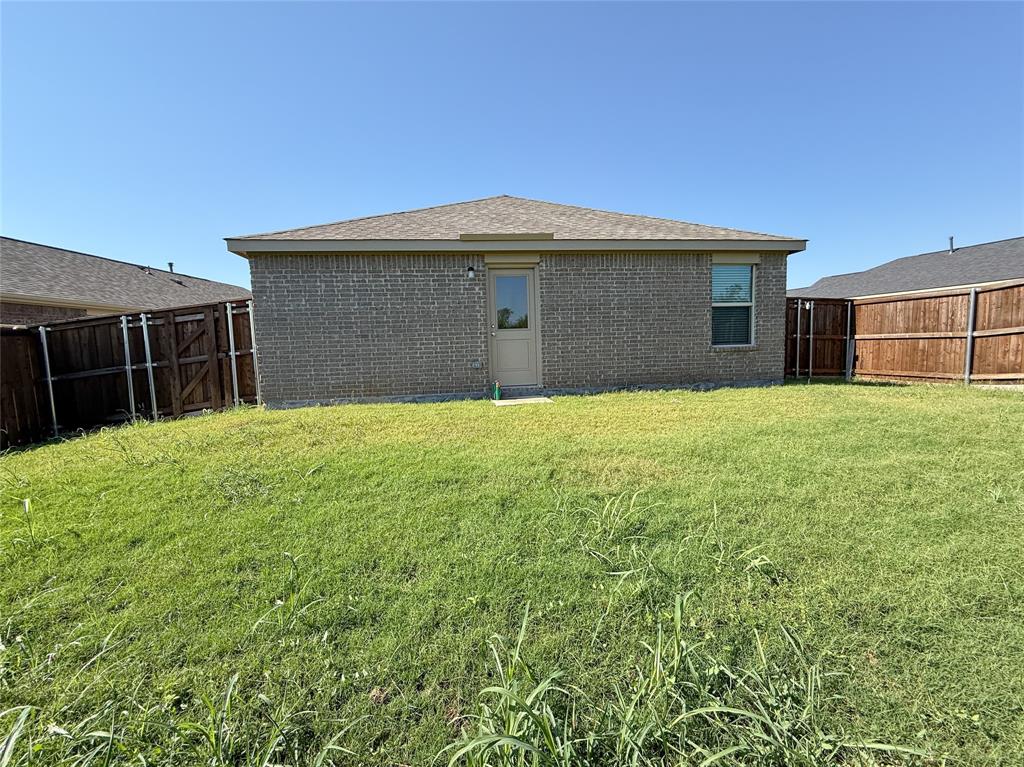 3701 Harper Street Little Elm, TX 75068 - Photo 23 of 26 a front view of a house with yard and garage