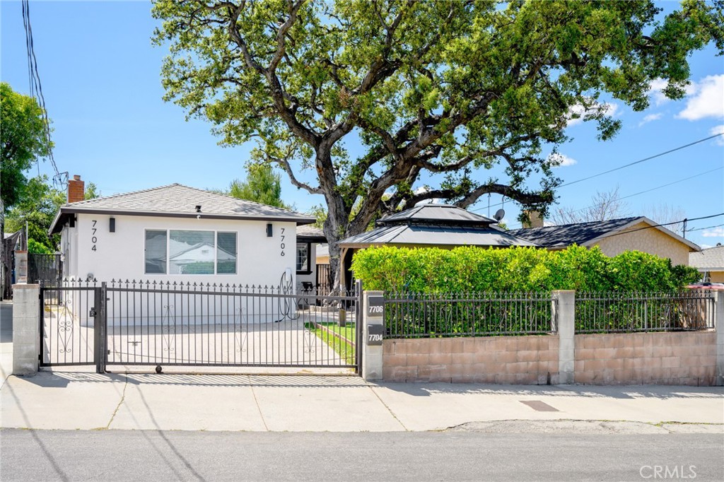 7704 Kyle Street Tujunga, CA 91042 - Photo 1 of 12 a front view of a house with a garden