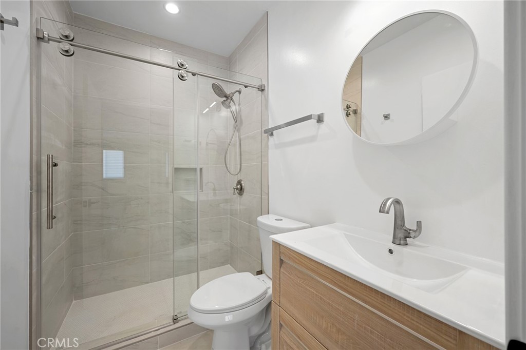 7704 Kyle Street Tujunga, CA 91042 - Photo 11 of 12 a bathroom with a sink toilet and shower