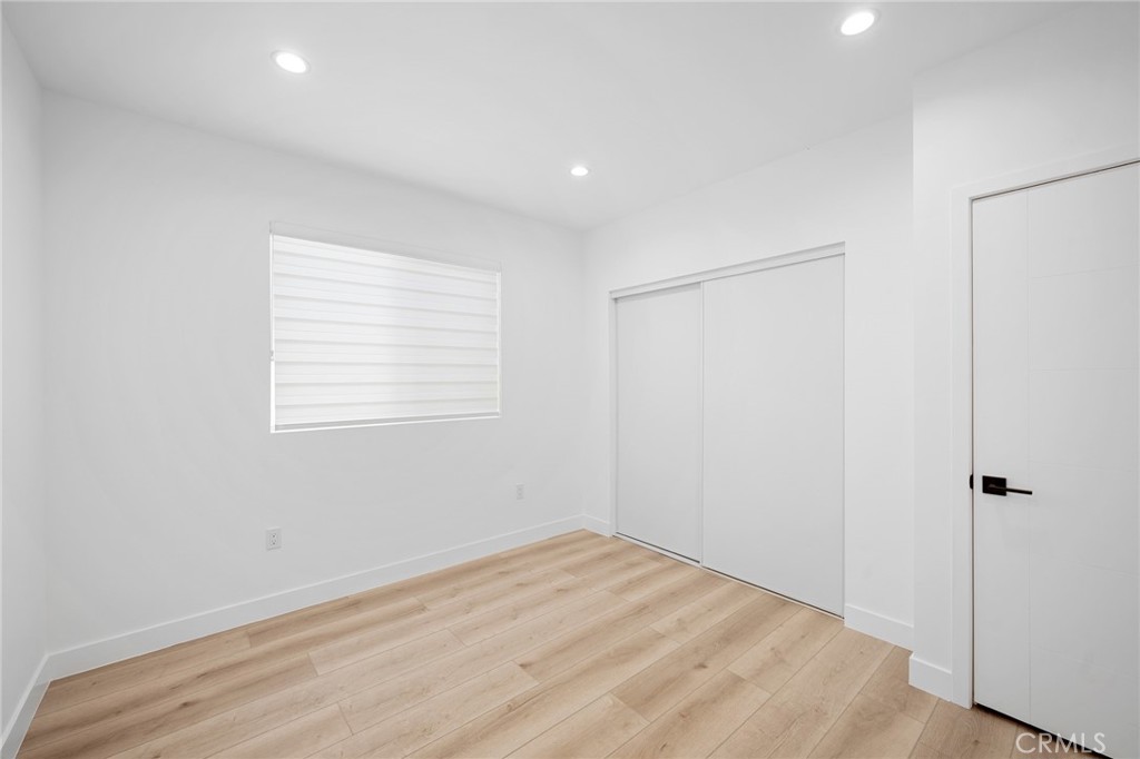 7704 Kyle Street Tujunga, CA 91042 - Photo 9 of 12 a view of empty room with wooden floor