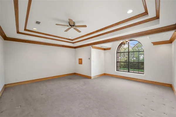 a room with walk in closet and window