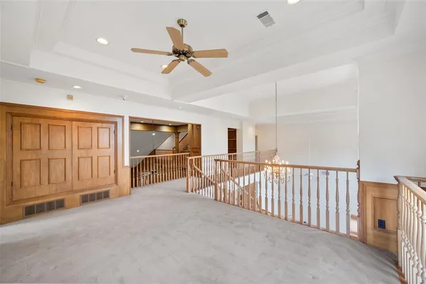 a kitchen with stainless steel appliances granite countertop a sink and dishwasher with white cabinets