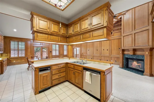 a kitchen with cabinets and stainless steel appliances