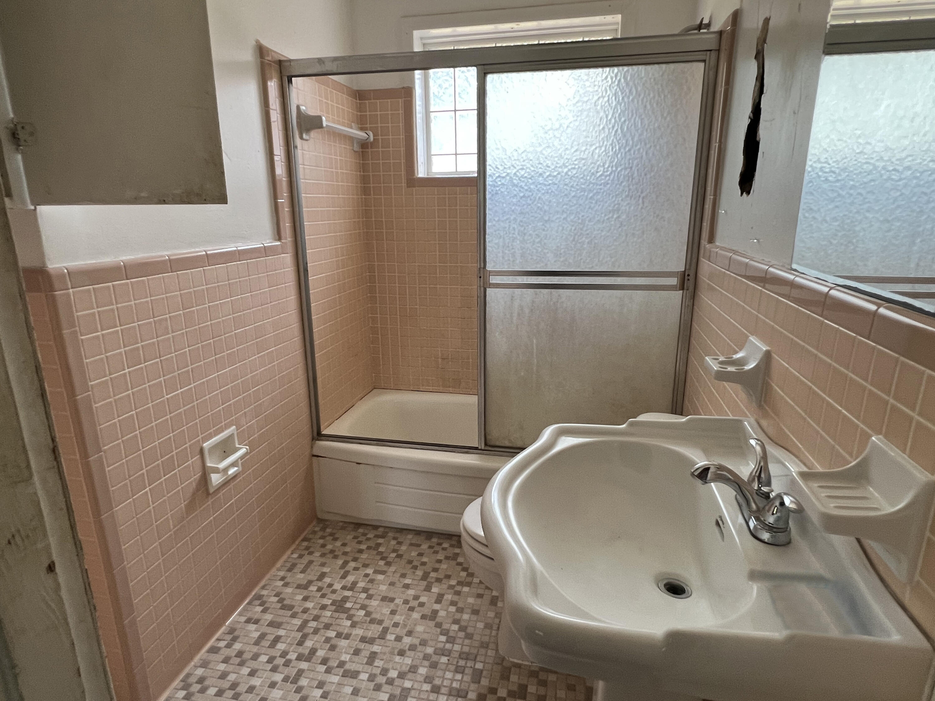 4104 Cooley Drive Pace, FL 32571 - Photo 11 of 21 a bathroom with a sink a toilet and shower