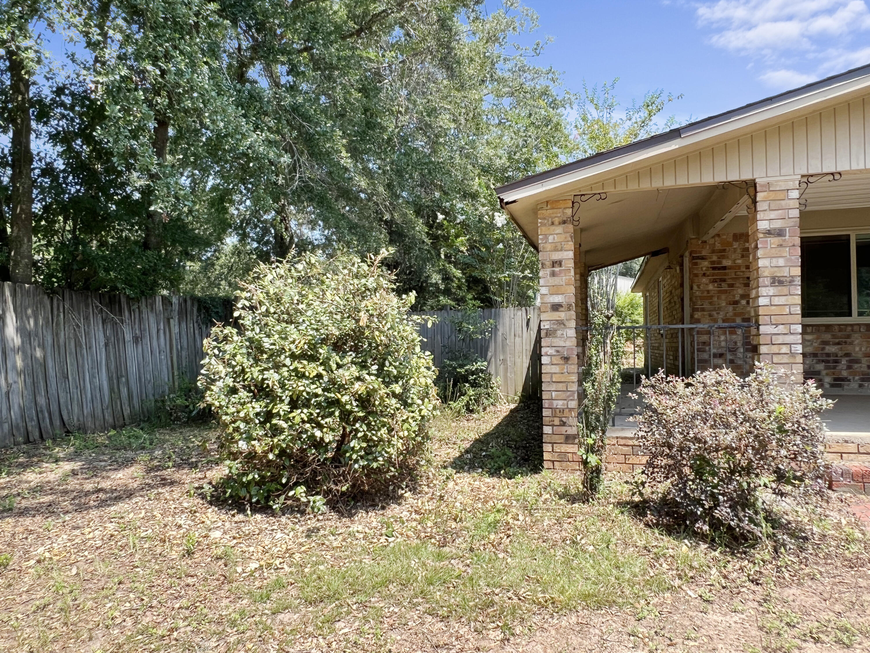 4104 Cooley Drive Pace, FL 32571 - Photo 12 of 21 a view of a house with a tree in the background
