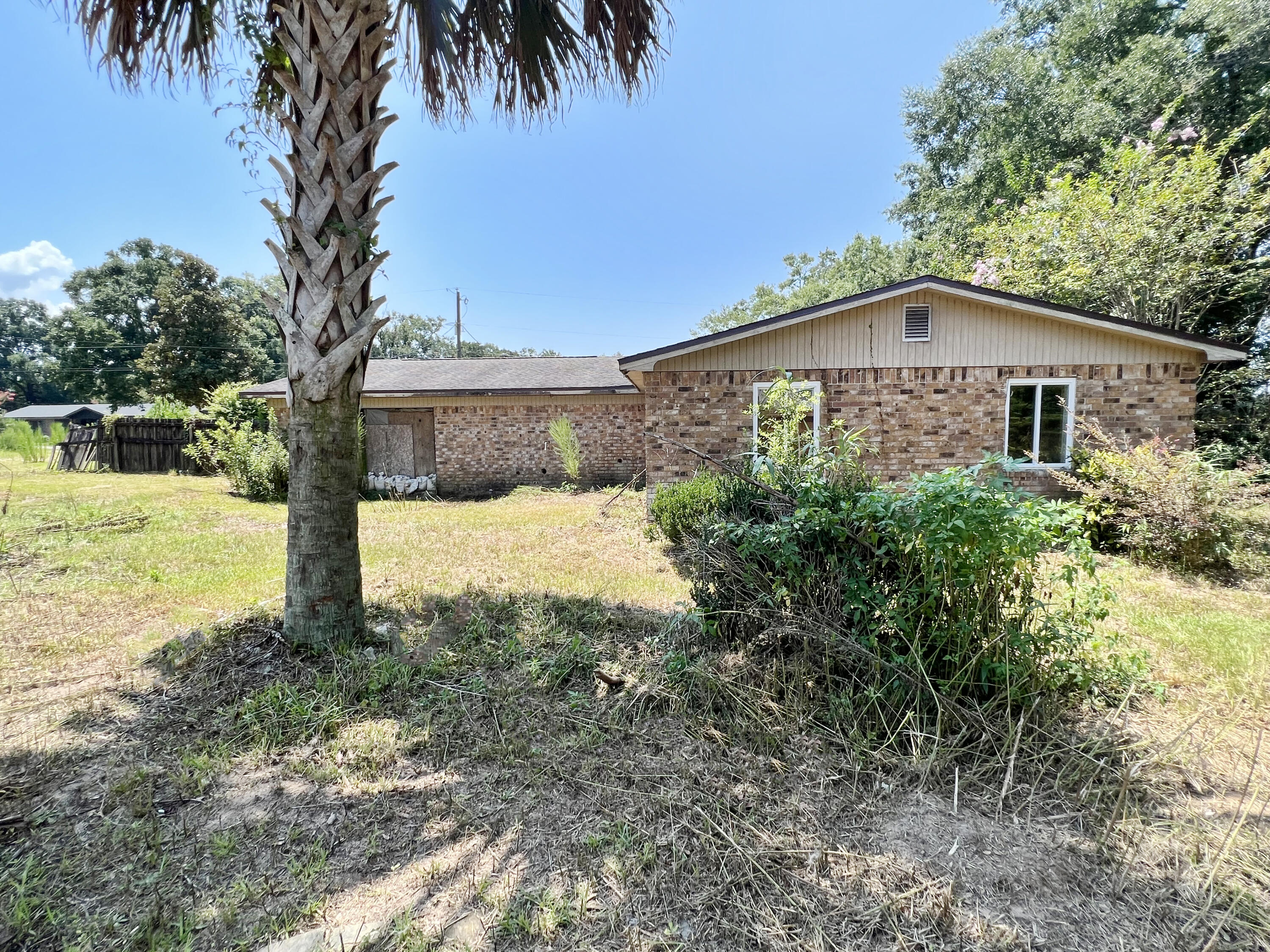 4104 Cooley Drive Pace, FL 32571 - Photo 15 of 21 a front view of a house with garden