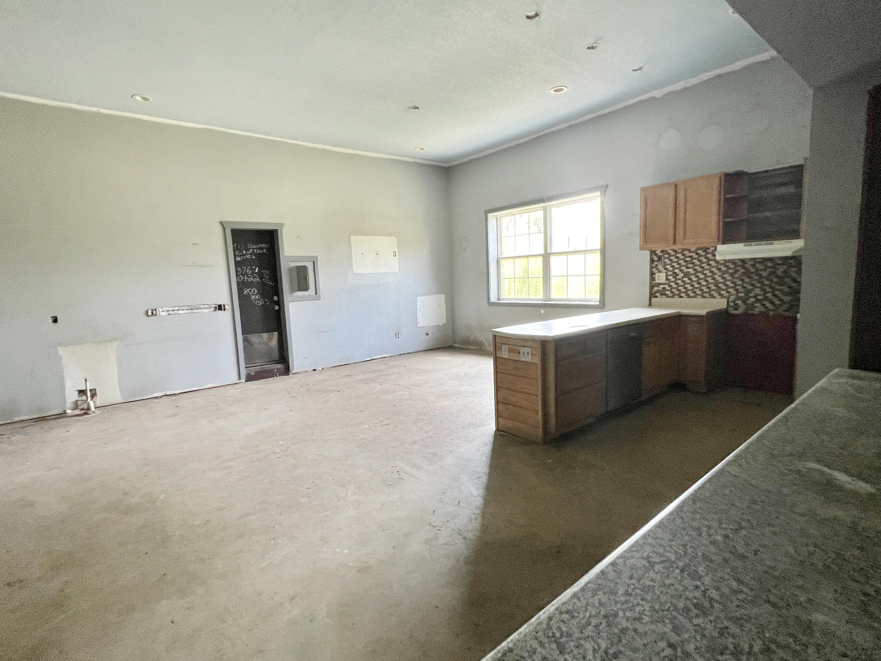 4104 Cooley Drive Pace, FL 32571 - Photo 19 of 21 a view of an empty room with window and cabinet