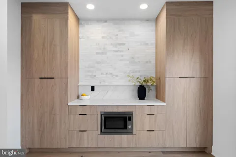 a kitchen with a stove a sink and a refrigerator