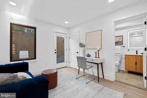 a view of a house with a door and wooden walls