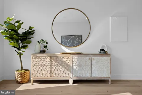 a view of entryway with wooden floor