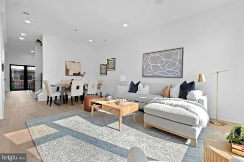 a living room with furniture and a table