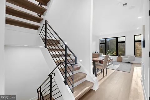 a livingroom with furniture staircase and a living room
