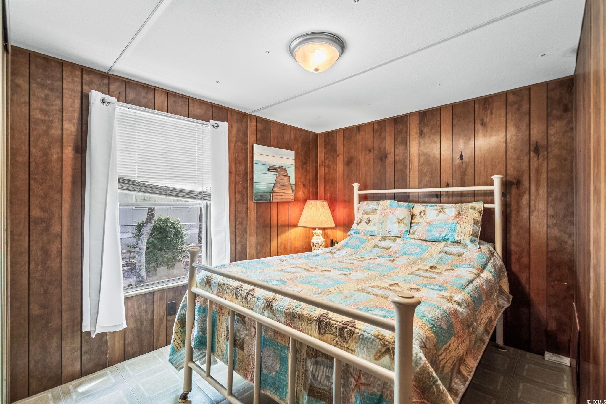 4516 Willet Street North Myrtle Beach, SC 29582 - Photo 28 of 40 Bedroom with wood walls