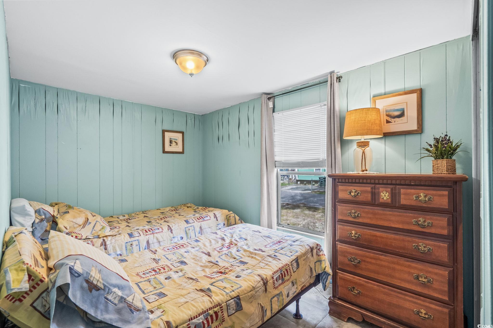 4516 Willet Street North Myrtle Beach, SC 29582 - Photo 29 of 40 Bedroom with wood walls