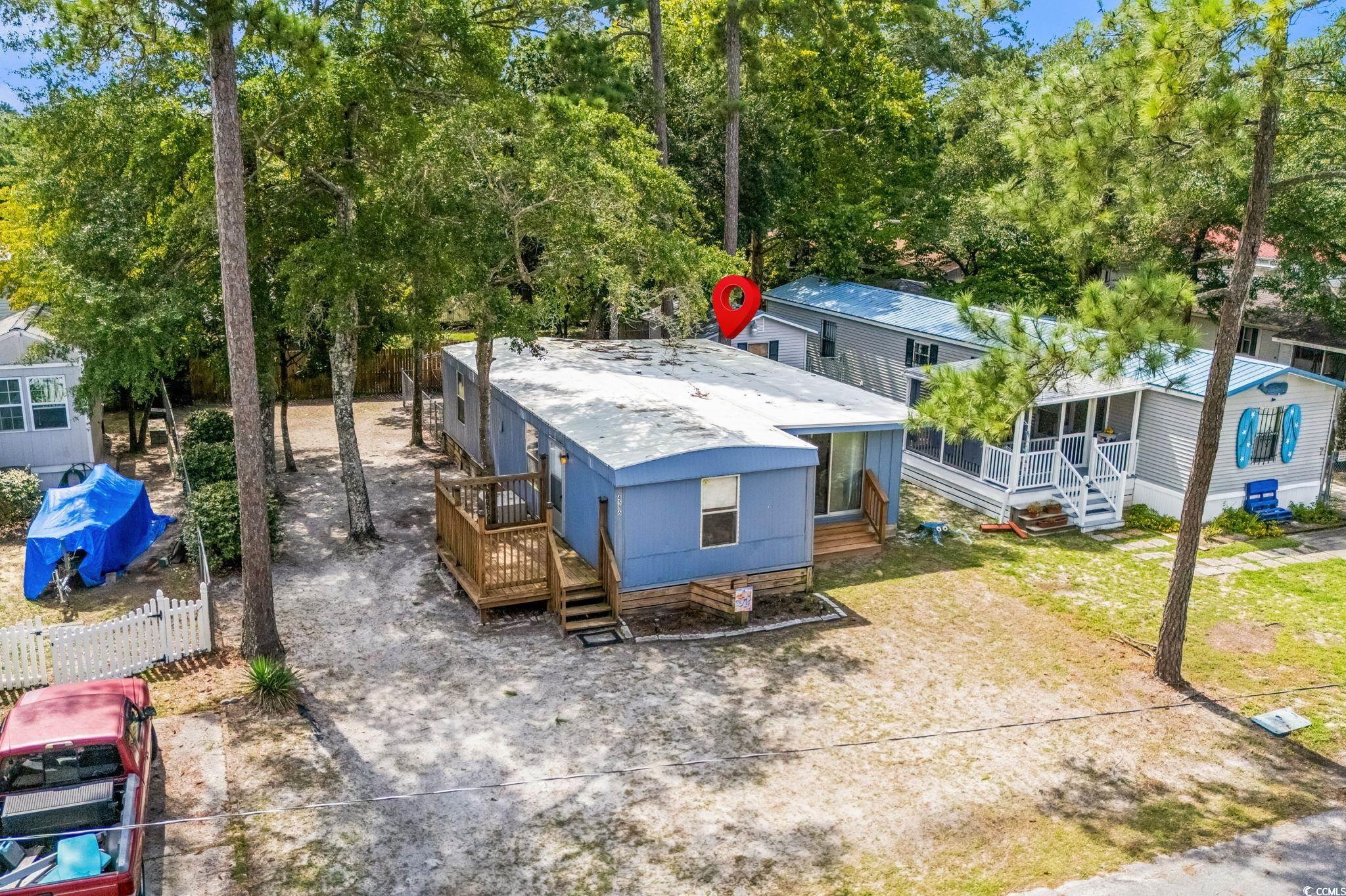 4516 Willet Street North Myrtle Beach, SC 29582 - Photo 36 of 40 Aerial view of property and surrounding area featuring a tree filled landscape