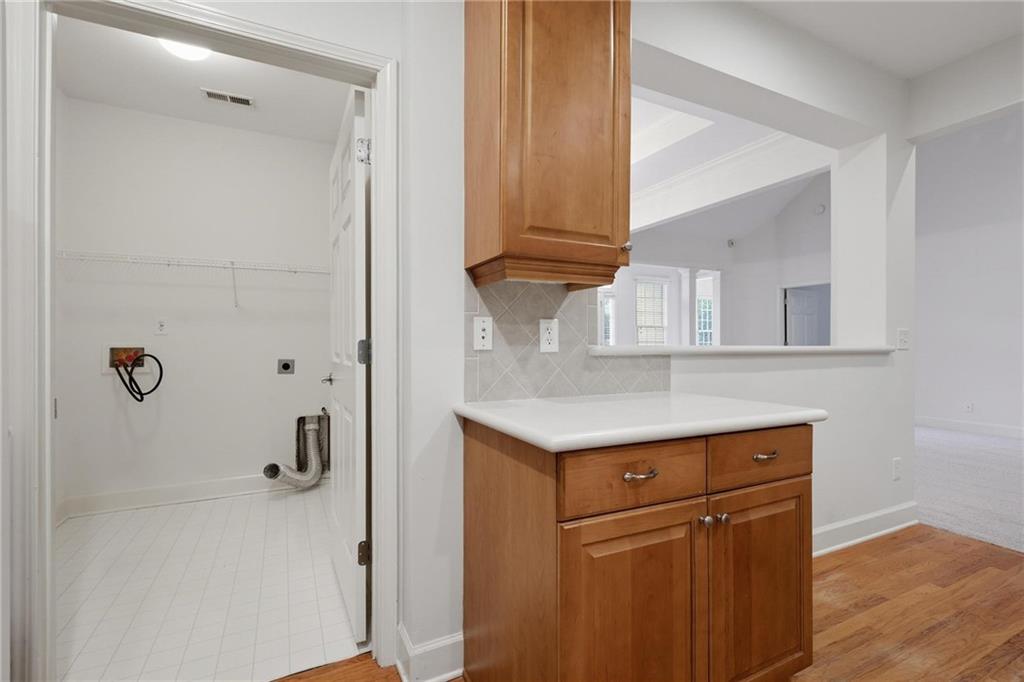 2017 MacLand Square Drive, Unit 9 Marietta, GA 30064 - Photo 13 of 30 a kitchen with a refrigerator sink and cabinets