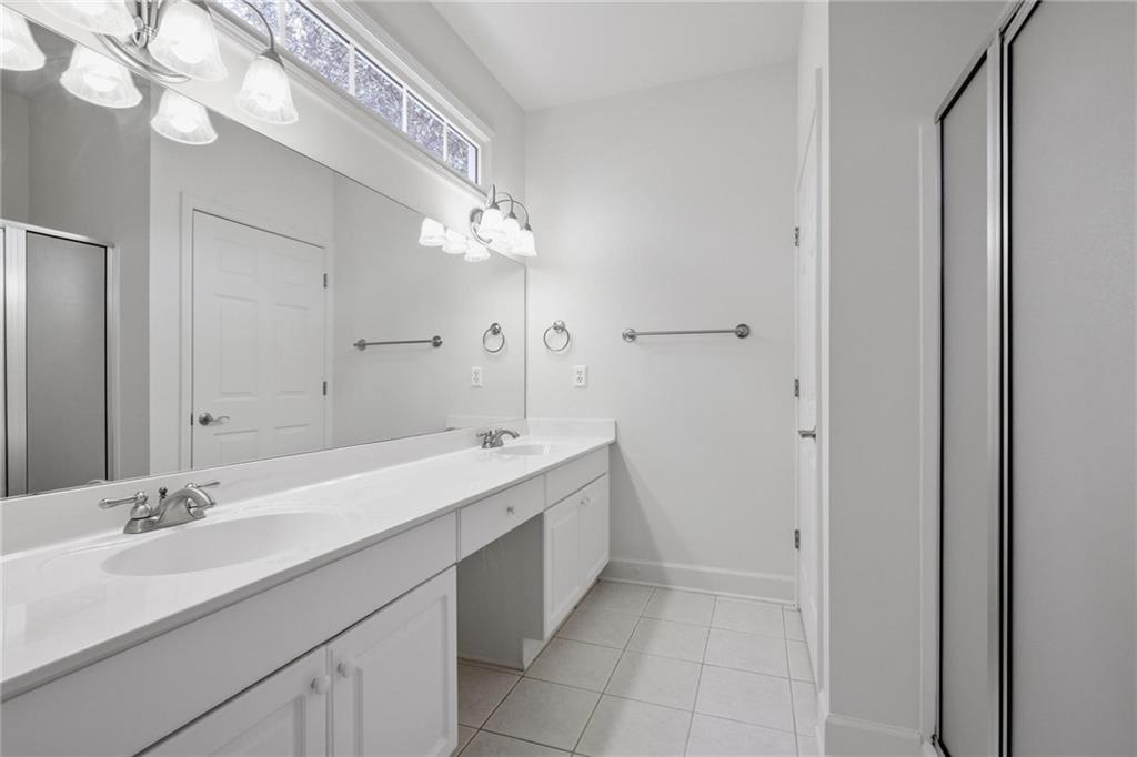 2017 MacLand Square Drive, Unit 9 Marietta, GA 30064 - Photo 17 of 30 a spacious bathroom with a double vanity sink mirror and double