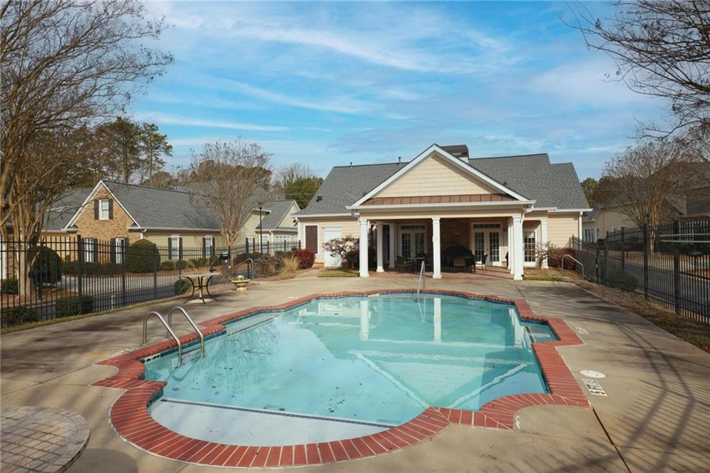 2017 MacLand Square Drive, Unit 9 Marietta, GA 30064 - Photo 26 of 30 a view of a house with swimming pool