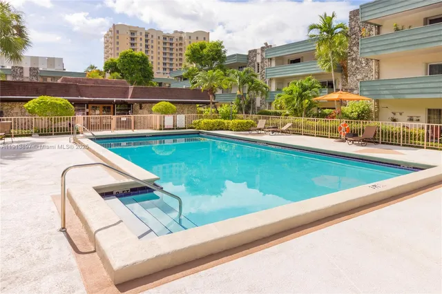 a view of swimming pool with chairs