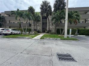 8305 Southwest 72nd Avenue, Unit 105A Miami, FL 33143 - Photo 21 of 25 a view of a street with houses on the side