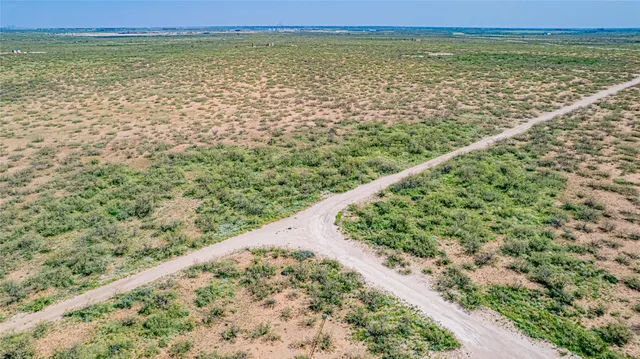 a view of a field with an outdoor space