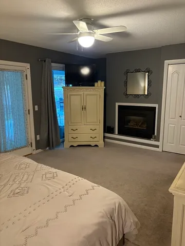 a bathroom with a toilet a sink and a window