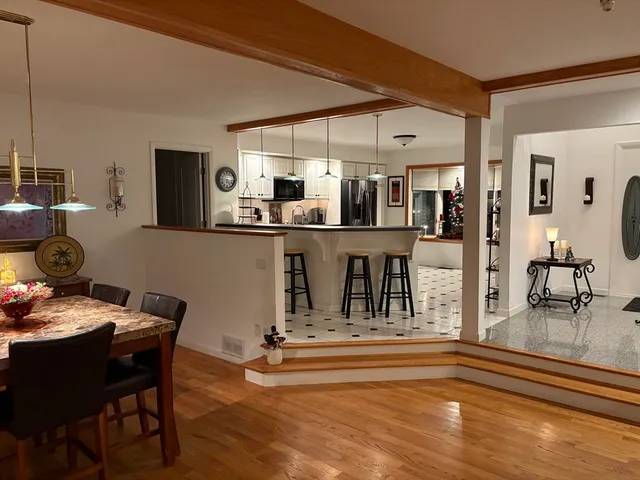 a bedroom with bed and window