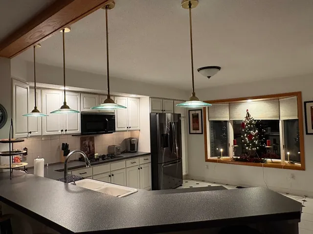 a bedroom with a bed and ceiling fan