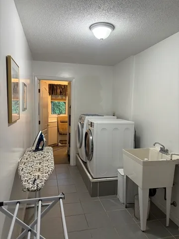 a bedroom with a bed and a fireplace