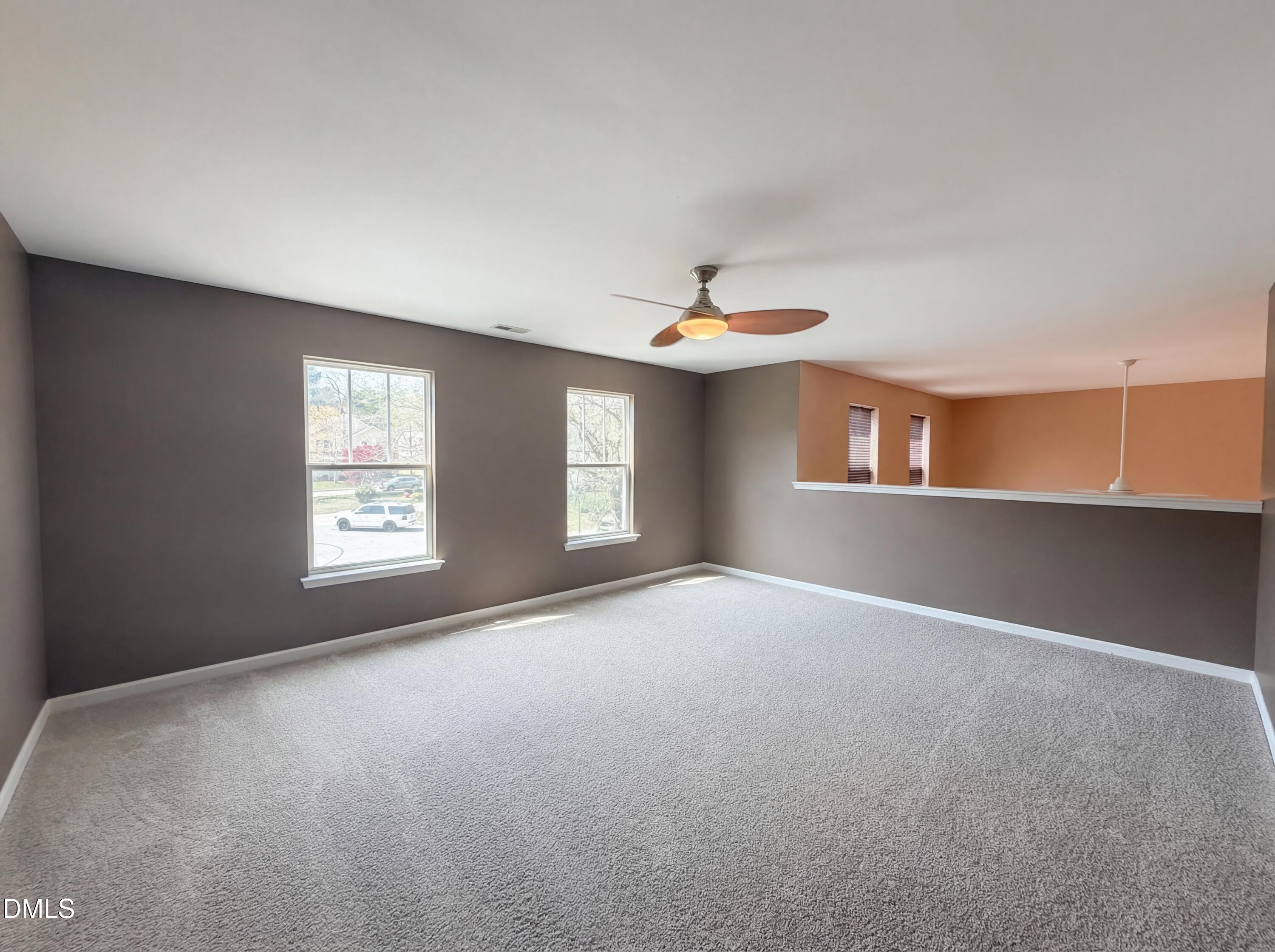 3712 Mayfair Mill Drive Raleigh, NC 27616 - Photo 12 of 16 a view of an empty room with windows