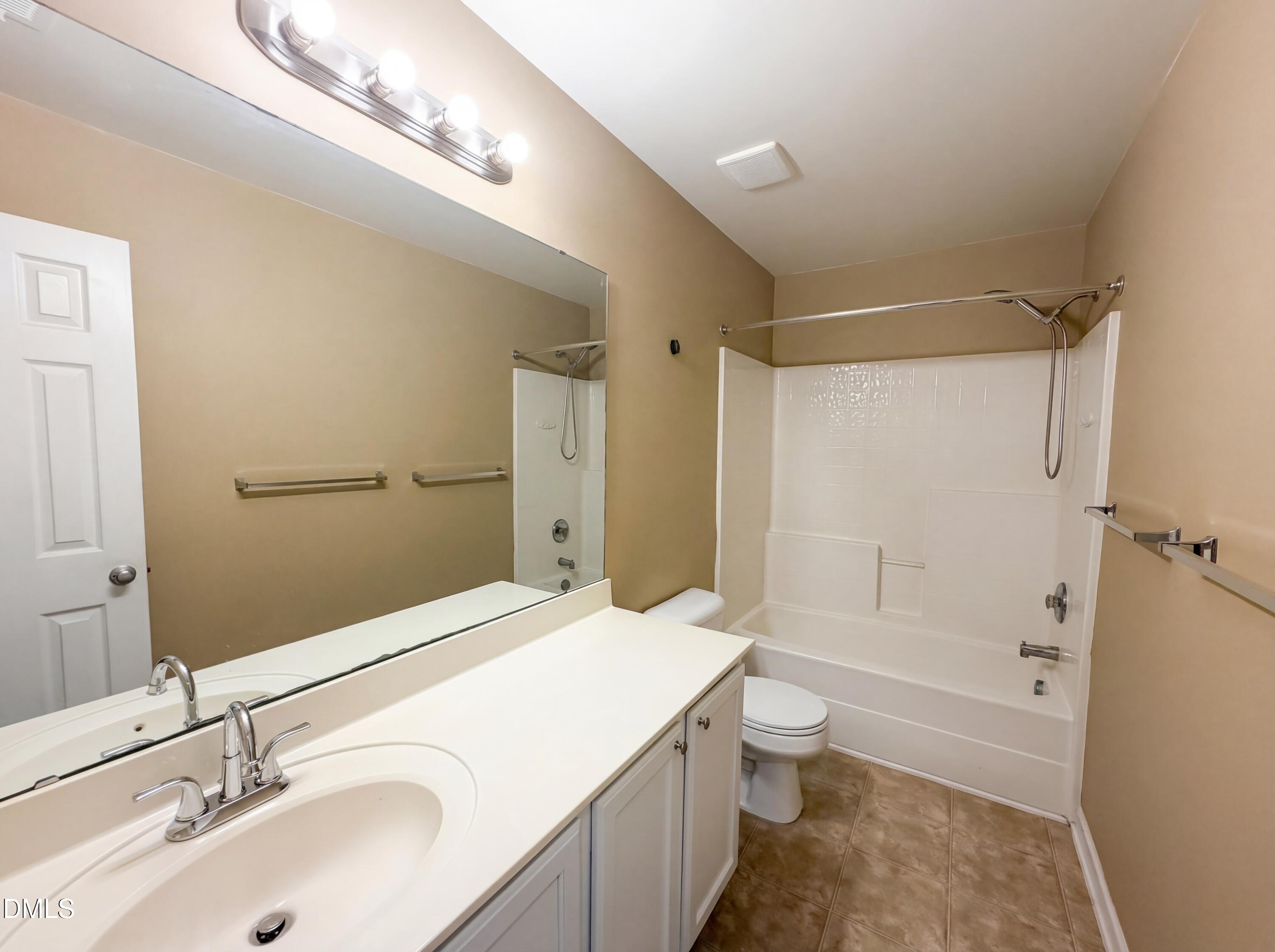 3712 Mayfair Mill Drive Raleigh, NC 27616 - Photo 15 of 16 a bathroom with a sink a toilet and shower