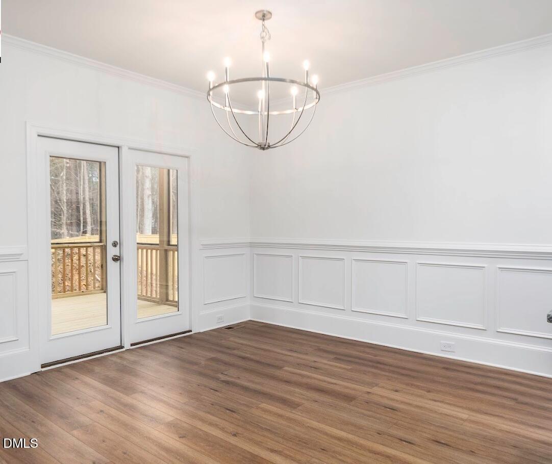 5 Arthur Wilder Road Spring Hope, NC 27882 - Photo 3 of 5 a view of an empty room with wooden floor and window
