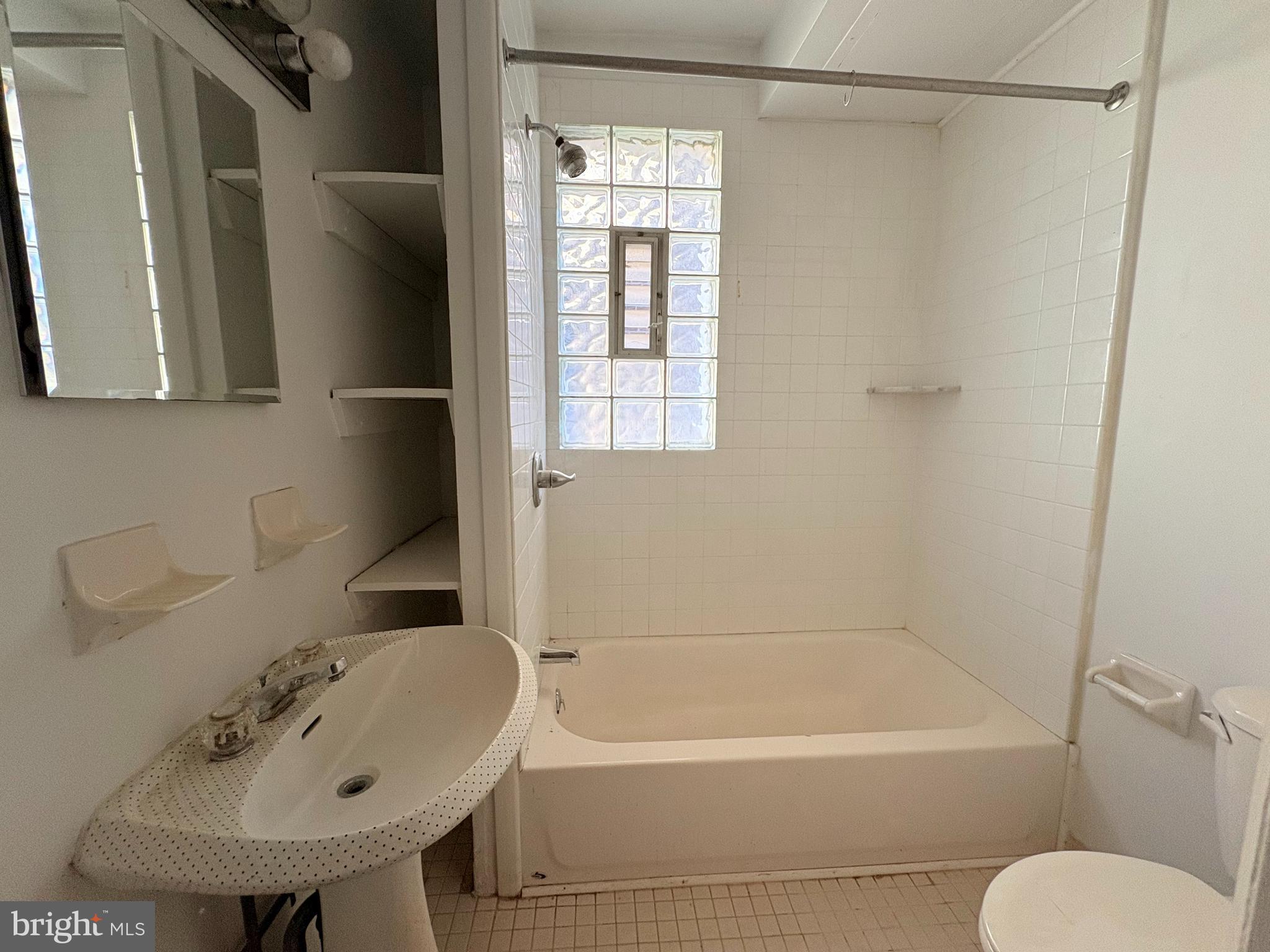 916 Clinton Street, Unit 3F Philadelphia, PA 19107 - Photo 8 of 15 a bathroom with a sink toilet and shower