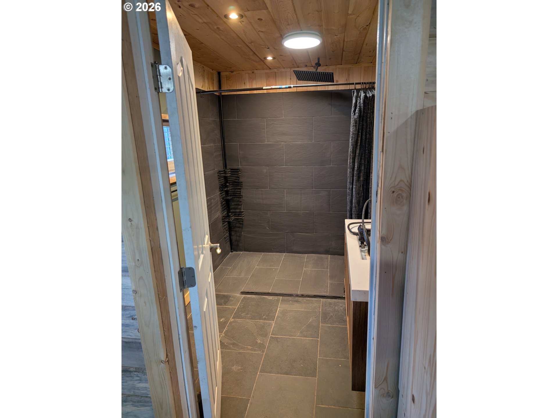 44786 Mission Road Pendleton, OR 97801 - Photo 12 of 19 a bathroom with a shower and a glass door