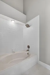 an aerial view of a house with a yard and lake view