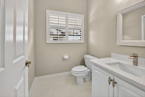 an aerial view of residential houses with outdoor space and lake view