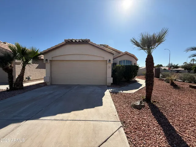 a view of an empty room with a ceiling fan and window