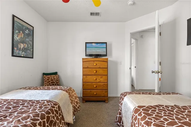 a bedroom with a bed and walk in closet