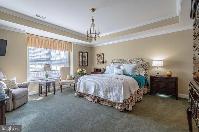 a view of a dining room with furniture and window