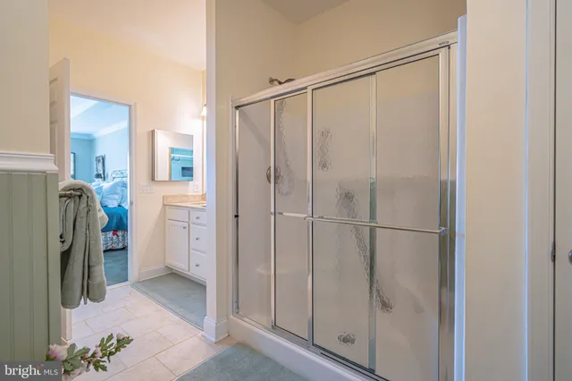 a bedroom with a bed and a table in it