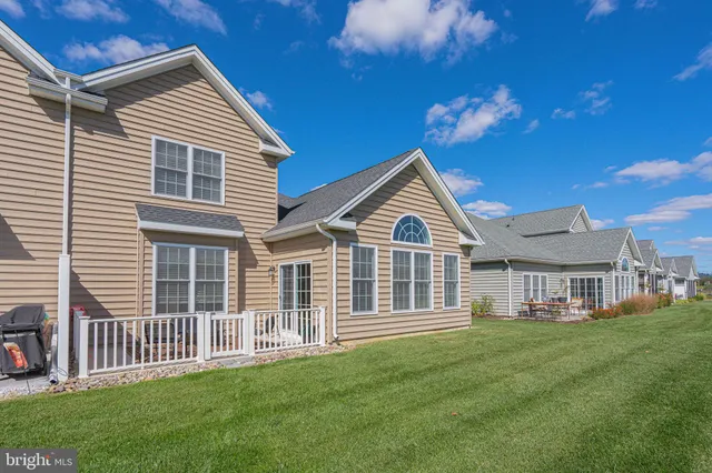 an aerial view of a house and outdoor space