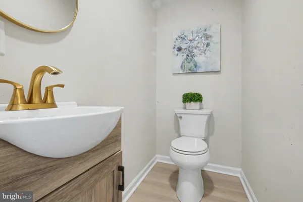 a bathroom with a toilet and a sink