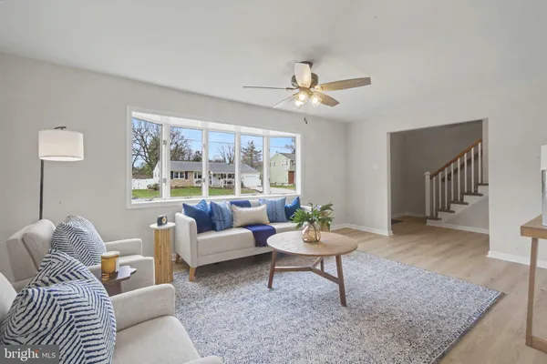 a living room with furniture and a rug